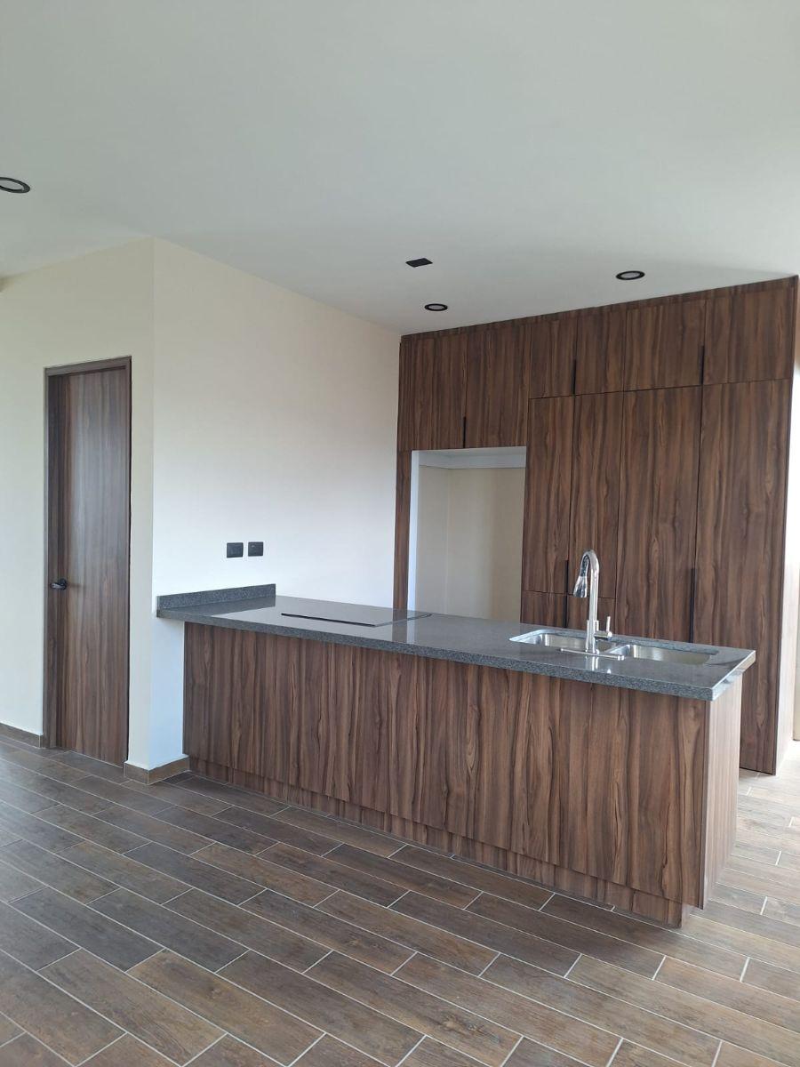 Cocina abierta del loft en Palmares